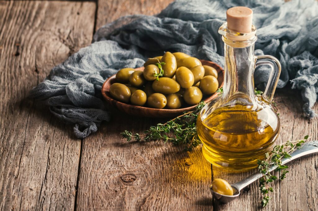 Olive oil and bowl of olives
