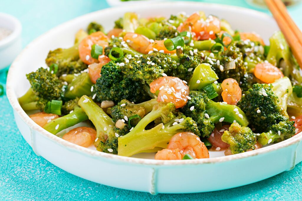Steamed Broccoli Nutrition Facts: Unlocking the Power of Green Goodness 2 Stir fry shrimp with broccoli close up on a plate. Prawns and broccoli.